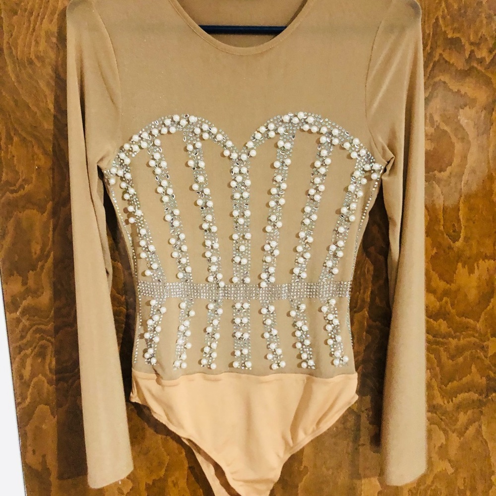 Size medium beaded body suit , never worn.